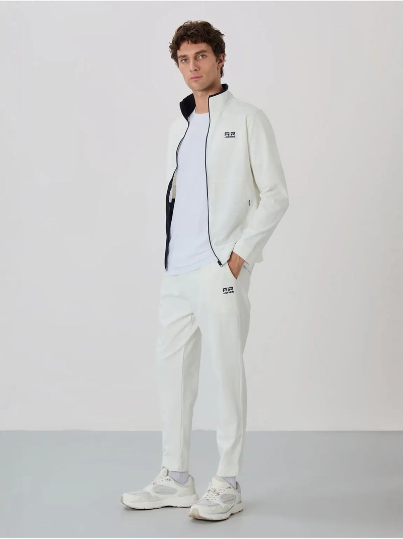 Set da uomo con felpa con collo con zip e pantaloni tommy Bianco sporco - Kiabi