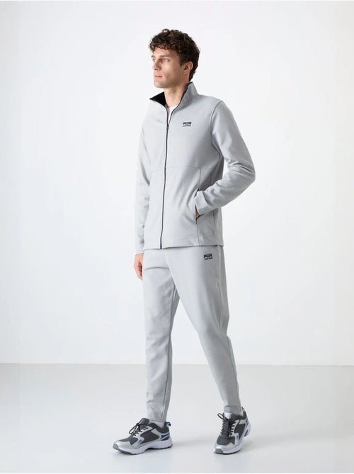 Set da uomo con felpa con collo con zip e pantaloni tommy - Kiabi Set da uomo con felpa con collo con zip e pantaloni tommy - Kiabi