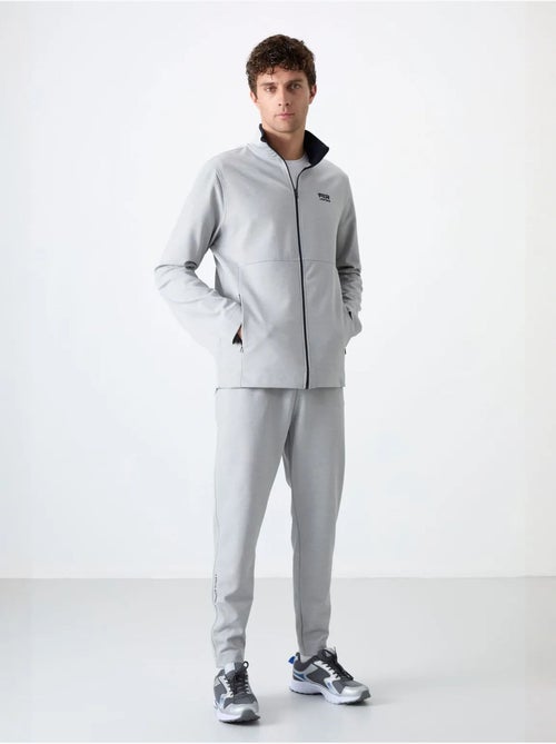 Set da uomo con felpa con collo con zip e pantaloni tommy - Kiabi Set da uomo con felpa con collo con zip e pantaloni tommy - Kiabi