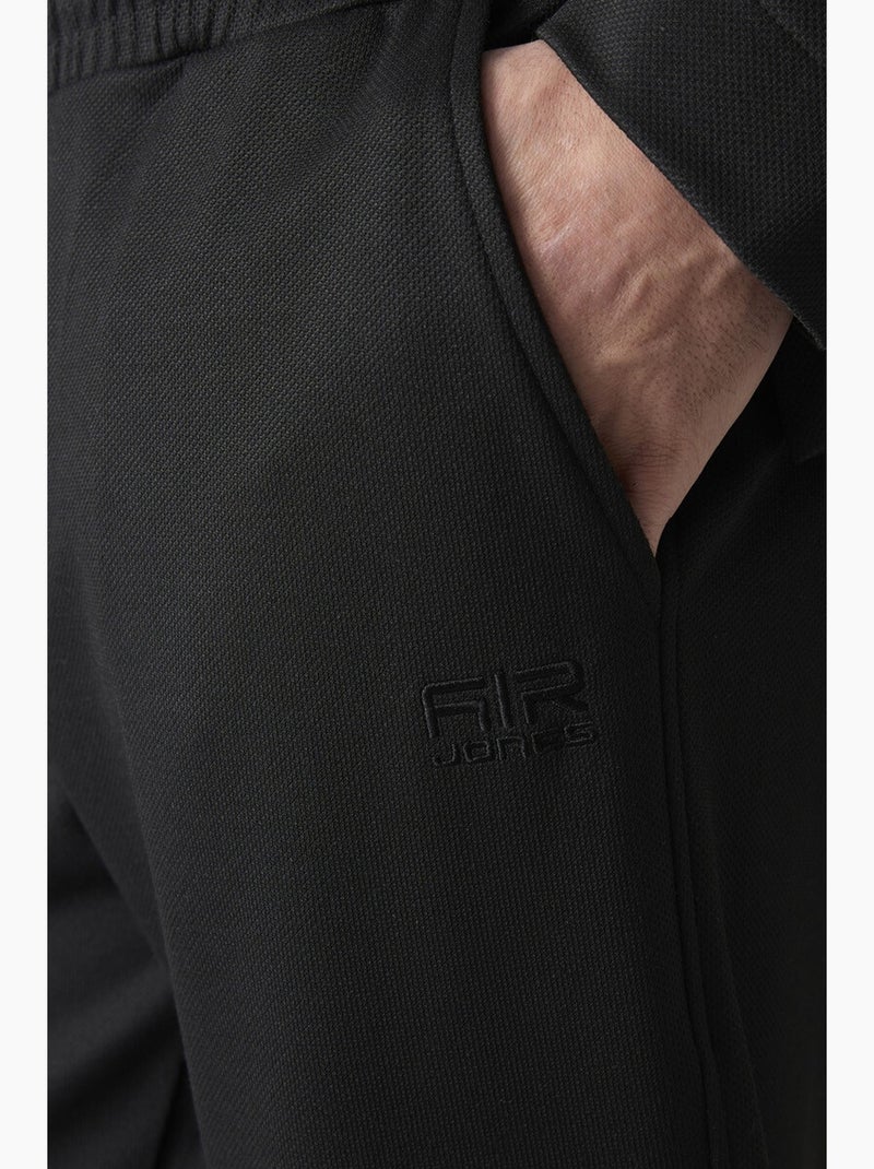 Set da uomo con felpa con collo con zip e pantaloni tommy Nero - Kiabi