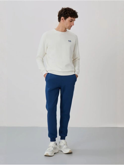 Set da uomo di felpa in pile di cotone e poliestere con sweatshirt e pantaloni tommy - Kiabi Set da uomo di felpa in pile di cotone e poliestere con sweatshirt e pantaloni tommy - Kiabi