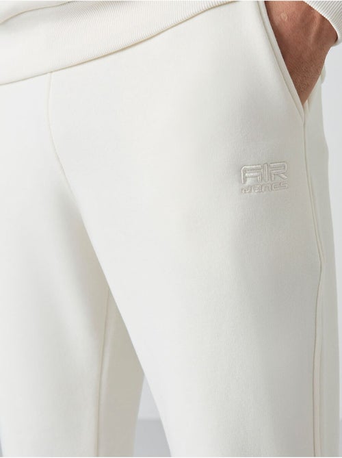Set da uomo di felpa in pile di cotone e poliestere con sweatshirt e pantaloni tommy - Kiabi Set da uomo di felpa in pile di cotone e poliestere con sweatshirt e pantaloni tommy - Kiabi
