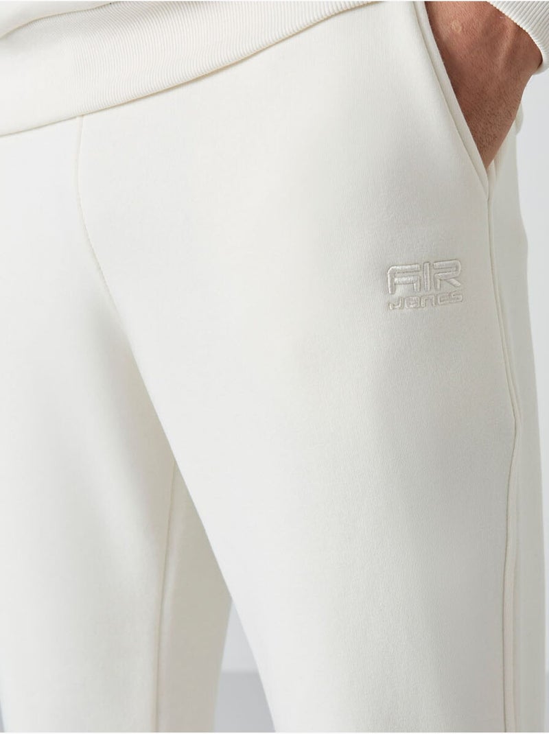 Set da uomo di felpa in pile di cotone e poliestere con sweatshirt e pantaloni tommy Bianco sporco - Kiabi