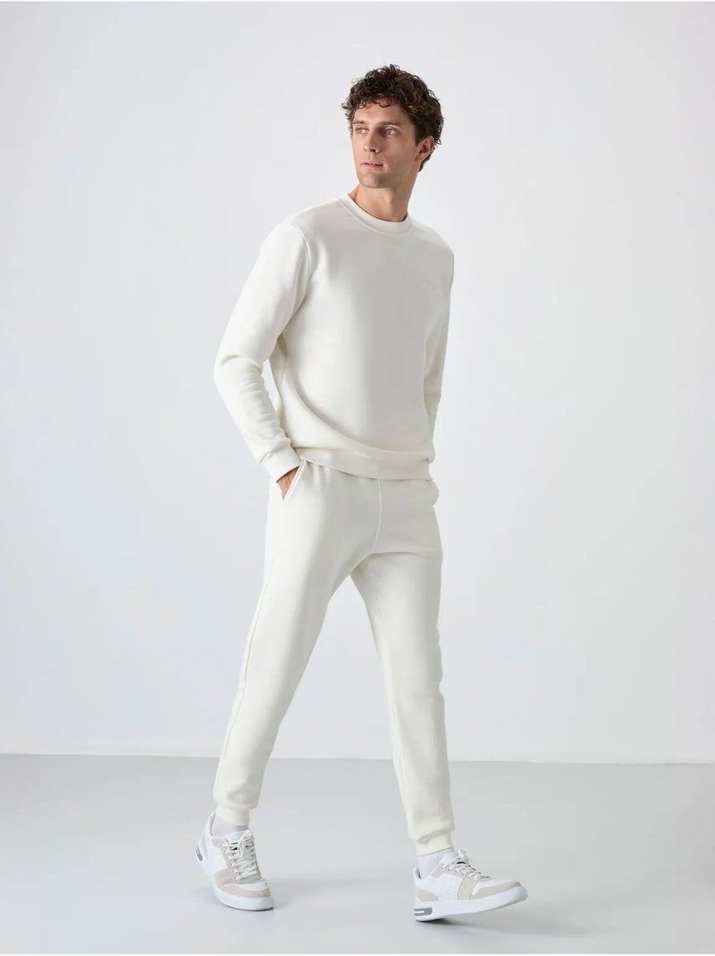 Set da uomo di felpa in pile di cotone e poliestere con sweatshirt e pantaloni tommy Bianco sporco - Kiabi