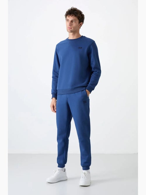 Set da uomo di felpa in pile di cotone e poliestere con sweatshirt e pantaloni tommy - Kiabi Set da uomo di felpa in pile di cotone e poliestere con sweatshirt e pantaloni tommy - Kiabi