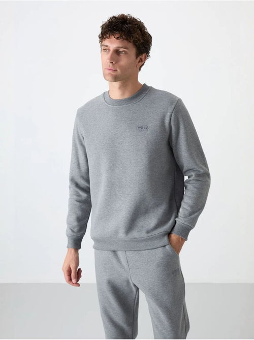 Set da uomo di felpa in pile di cotone e poliestere con sweatshirt e pantaloni tommy - Kiabi Set da uomo di felpa in pile di cotone e poliestere con sweatshirt e pantaloni tommy - Kiabi