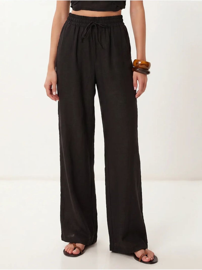 Set di blusa allacciata al collo e pantaloni a gamba larga istanbul Nero - Kiabi
