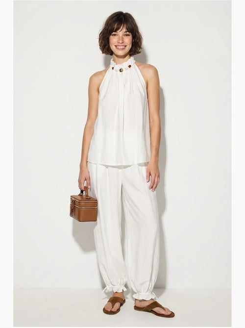 Set di blusa allacciata al collo e pantaloni a vita alta lucci - Kiabi Set di blusa allacciata al collo e pantaloni a vita alta lucci - Kiabi