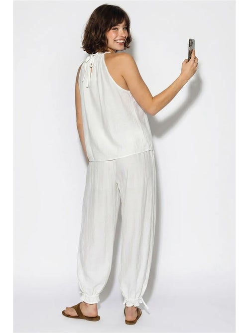Set di blusa allacciata al collo e pantaloni a vita alta lucci - Kiabi Set di blusa allacciata al collo e pantaloni a vita alta lucci - Kiabi