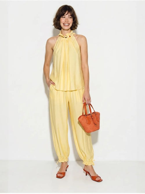 Set di blusa allacciata al collo e pantaloni a vita alta lucci - Kiabi Set di blusa allacciata al collo e pantaloni a vita alta lucci - Kiabi