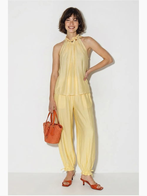 Set di blusa allacciata al collo e pantaloni a vita alta lucci - Kiabi Set di blusa allacciata al collo e pantaloni a vita alta lucci - Kiabi