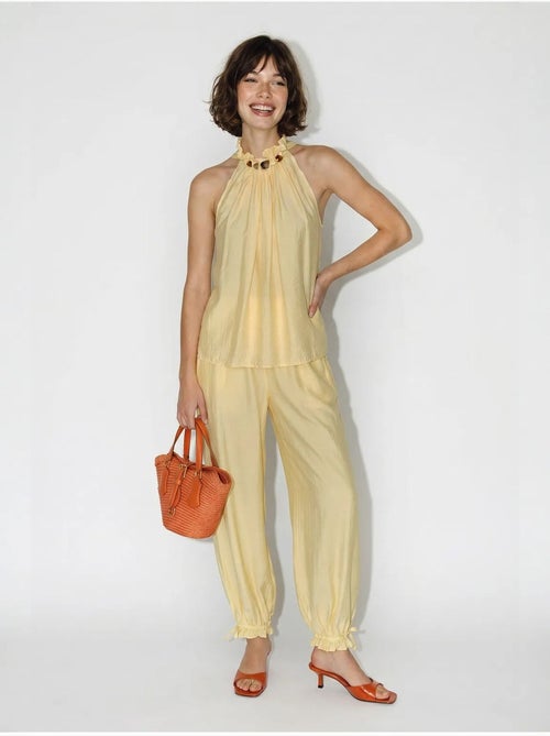 Set di blusa allacciata al collo e pantaloni a vita alta lucci - Kiabi Set di blusa allacciata al collo e pantaloni a vita alta lucci - Kiabi