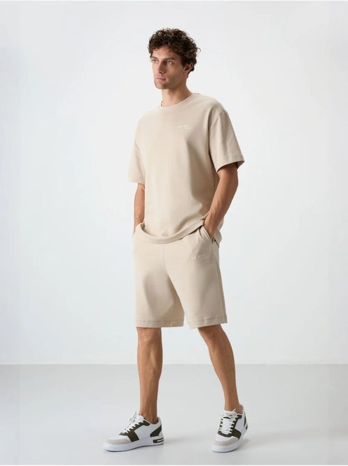 Set di t-shirt a maniche corte oversize e shorts tommy - Kiabi Set di t-shirt a maniche corte oversize e shorts tommy - Kiabi