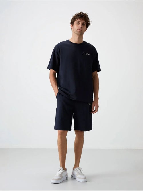 Set di t-shirt a maniche corte oversize e shorts tommy - Kiabi Set di t-shirt a maniche corte oversize e shorts tommy - Kiabi