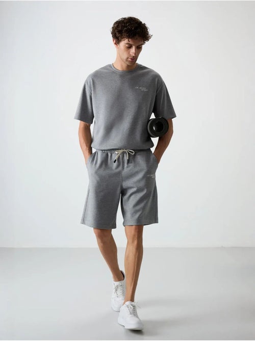 Set di t-shirt a maniche corte oversize e shorts tommy - Kiabi Set di t-shirt a maniche corte oversize e shorts tommy - Kiabi