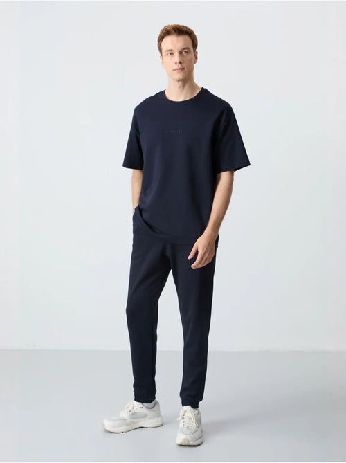 Set di t-shirt oversize e pantaloni da uomo tommy - Kiabi Set di t-shirt oversize e pantaloni da uomo tommy - Kiabi