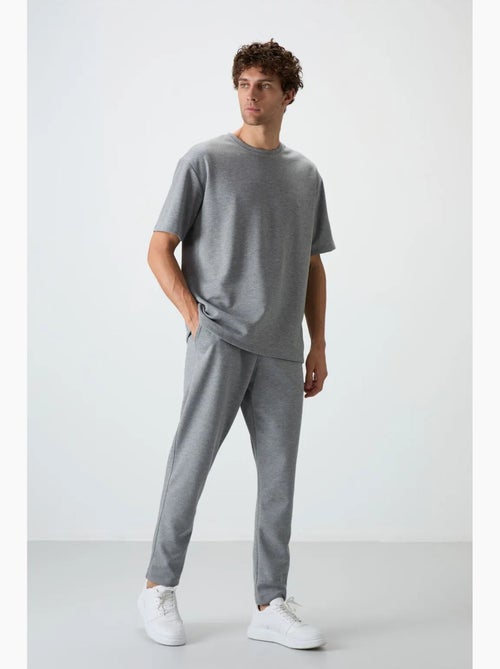 Set di t-shirt oversize e pantaloni da uomo tommy - Kiabi Set di t-shirt oversize e pantaloni da uomo tommy - Kiabi