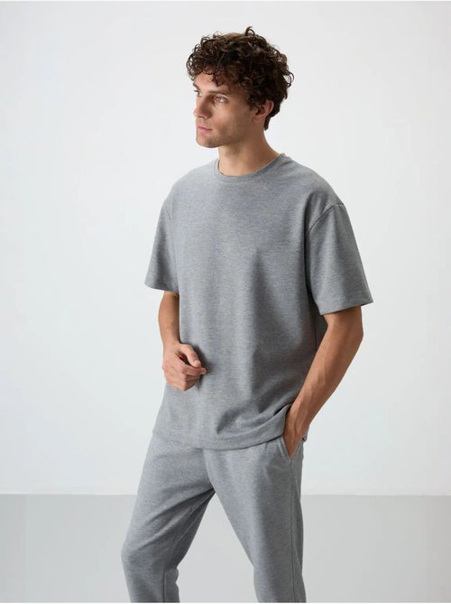 Set di t-shirt oversize e pantaloni da uomo tommy - Kiabi Set di t-shirt oversize e pantaloni da uomo tommy - Kiabi