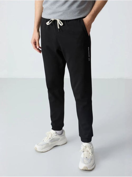 Set di t-shirt oversize e pantaloni da uomo tommy - Kiabi Set di t-shirt oversize e pantaloni da uomo tommy - Kiabi