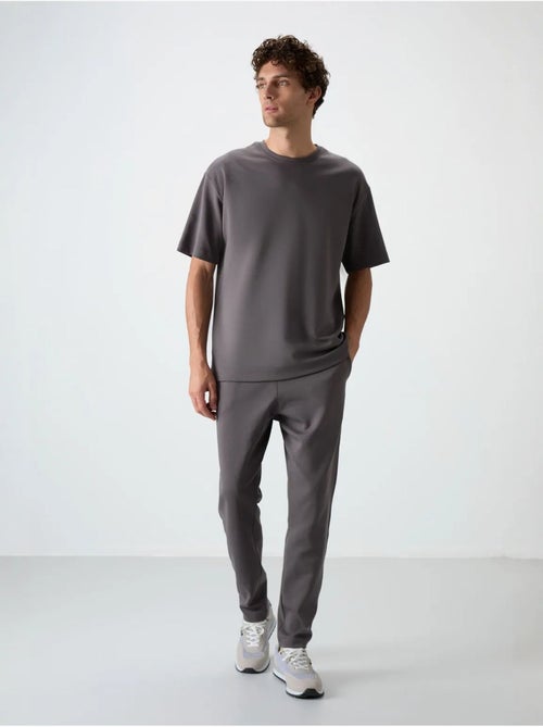 Set di t-shirt oversize e pantaloni da uomo tommy - Kiabi Set di t-shirt oversize e pantaloni da uomo tommy - Kiabi