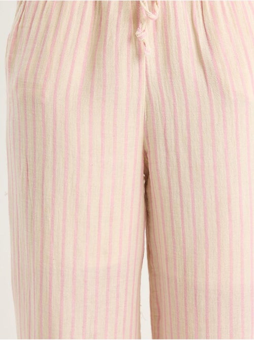 Set due pezzi a righe con scollo a v, bottoni, vita alta e gamba ampia lucci - Kiabi Set due pezzi a righe con scollo a v, bottoni, vita alta e gamba ampia lucci - Kiabi