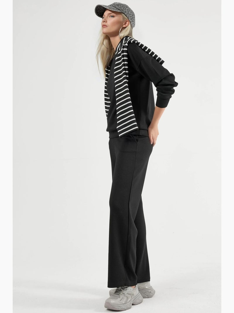 Set due pezzi con felpa girocollo modal touch e pantaloni a gamba ampia hiccup Nero - Kiabi