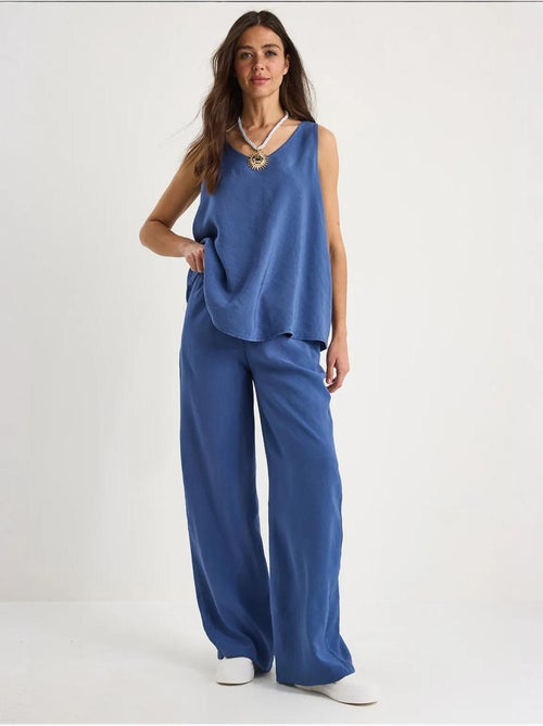 Set due pezzi in cotone con blusa scollo a v e pantaloni lucci - Kiabi Set due pezzi in cotone con blusa scollo a v e pantaloni lucci - Kiabi
