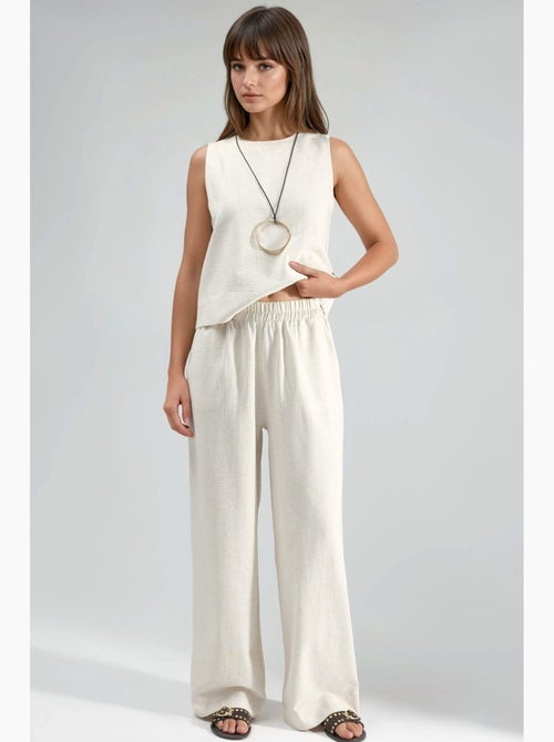 Set due pezzi in lino: blusa senza maniche e pantaloni con tasche hiccup - Kiabi Set due pezzi in lino: blusa senza maniche e pantaloni con tasche hiccup - Kiabi