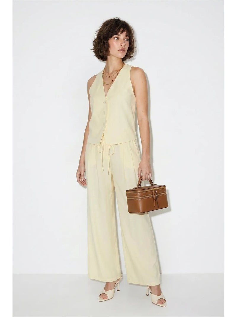Set in cotone con gilet e pantaloni a gamba larga lucci Crema - Kiabi
