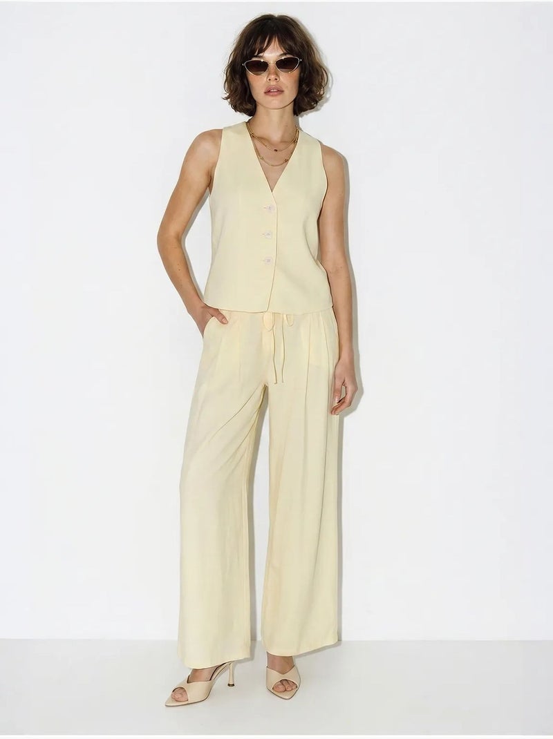 Set in cotone con gilet e pantaloni a gamba larga lucci Crema - Kiabi