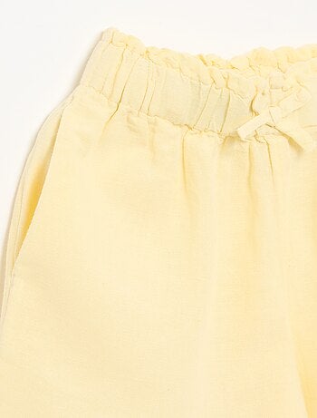 Short a tinta unita con fiocco decorativo