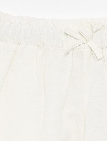 Short a tinta unita con fiocco fantasia