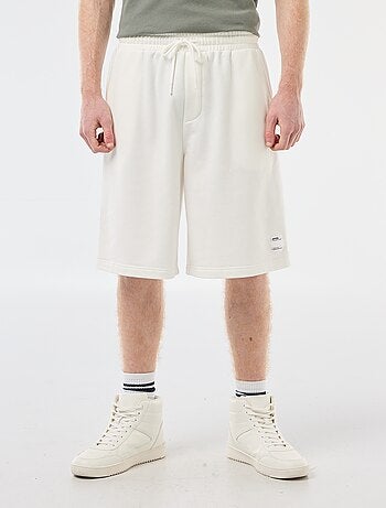 Short con patch in cotone tinta unita