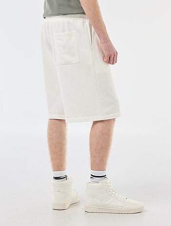 Short con patch in cotone tinta unita