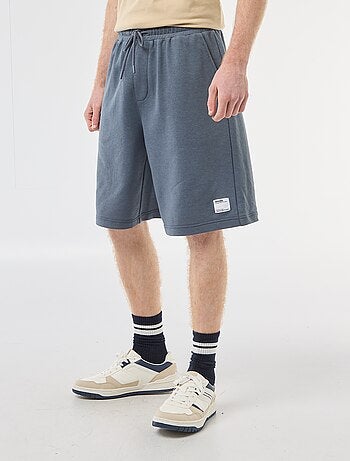 Short con patch in cotone tinta unita