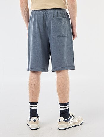 Short con patch in cotone tinta unita