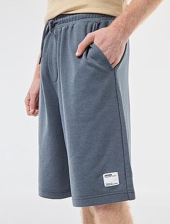 Short con patch in cotone tinta unita