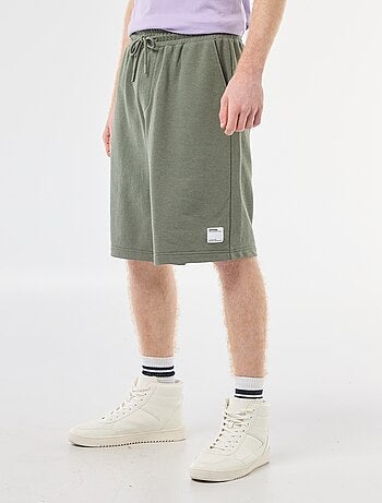Short con patch in cotone tinta unita