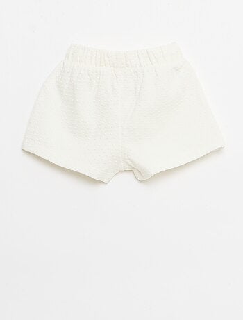 Short in maglia jacquard a tinta unita con fiocco decorativo