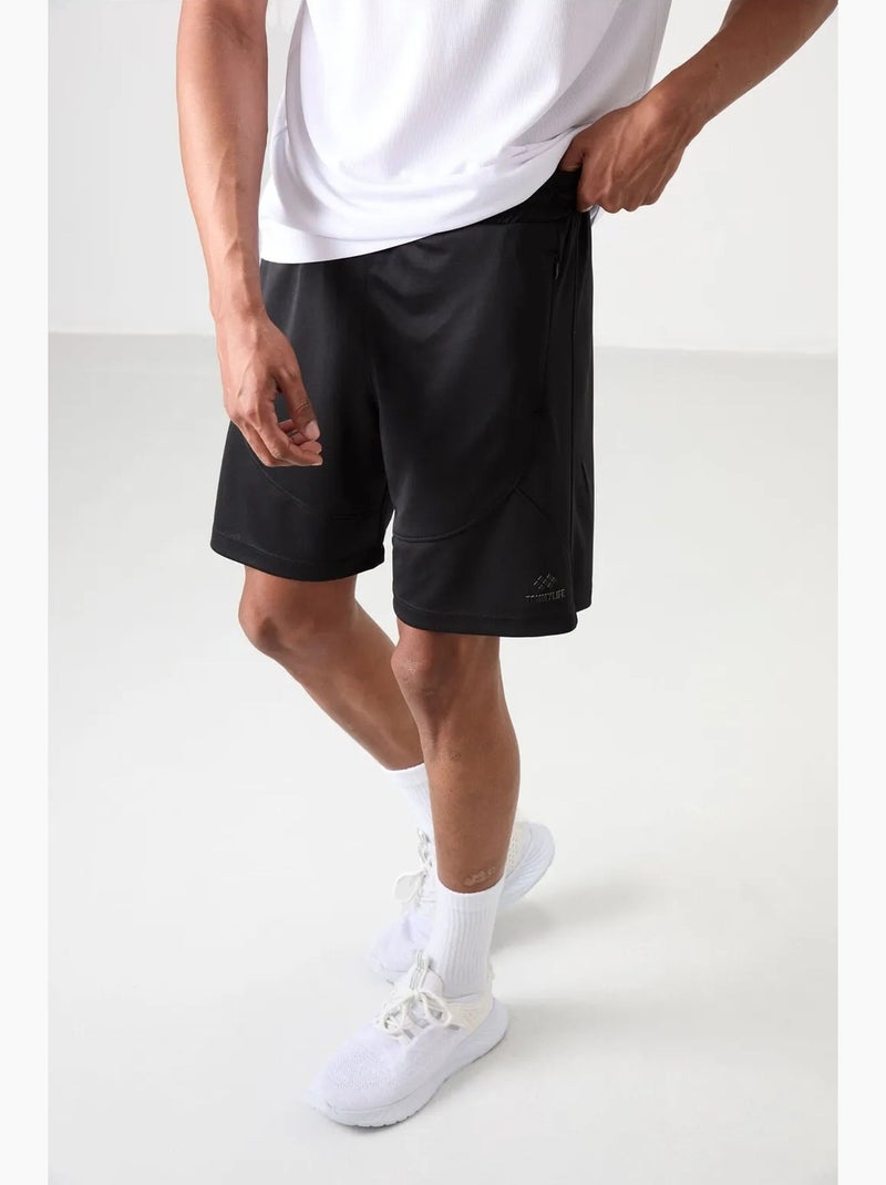 Short jogging tinta unita in maglia tommy Nero - Kiabi