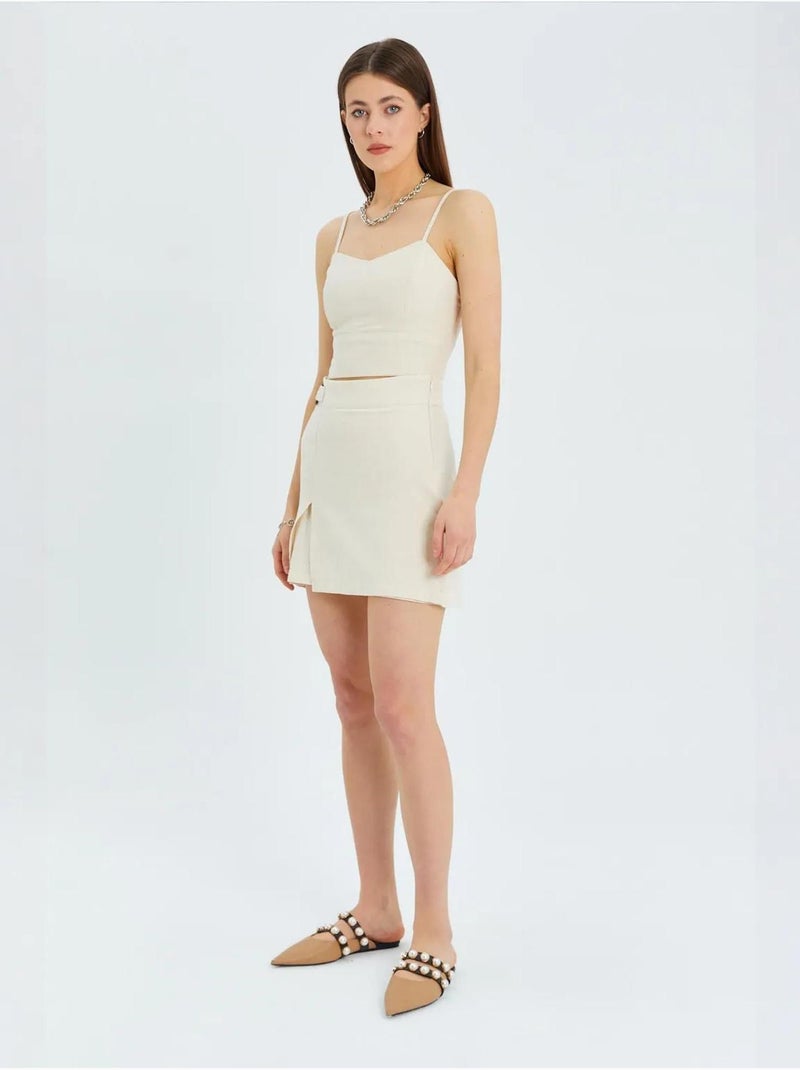 Shorts a vita alta con portafoglio sul davanti, cintura e dettaglio con spacco mixray Crema - Kiabi