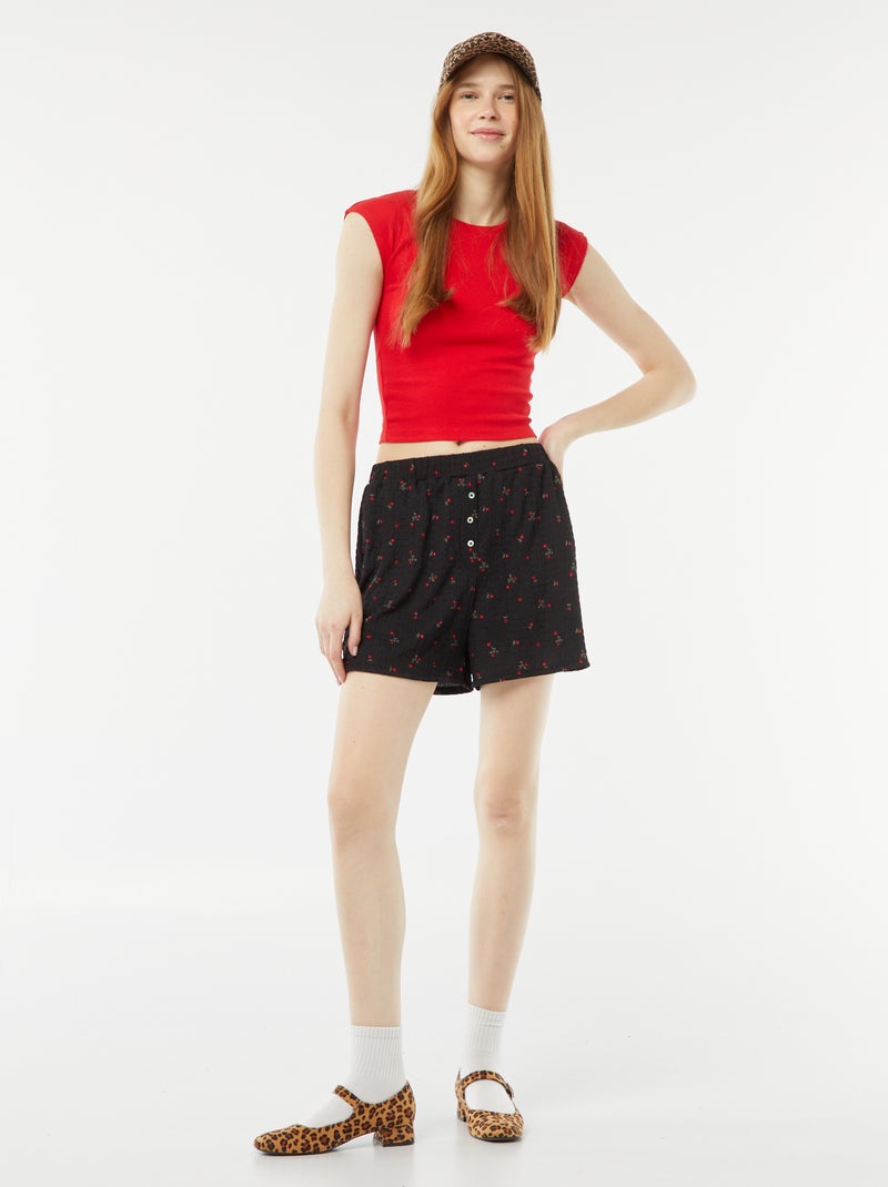 Shorts in maglia goffrata con motivo NERO - Kiabi