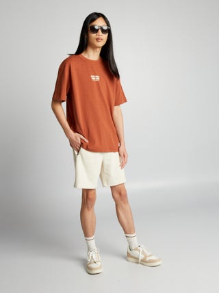 Shorts in tessuto felpato con tasche con zip