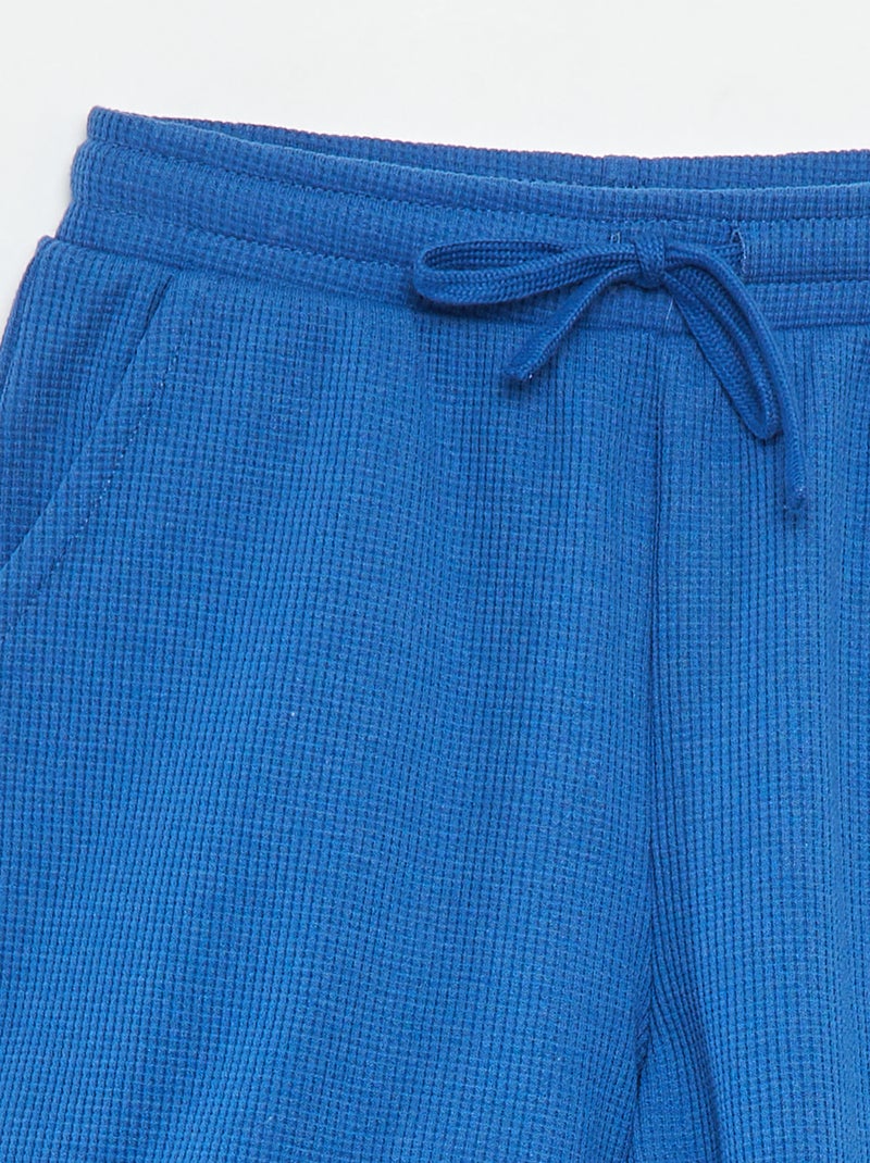 Shorts tinta unita in tessuto goffrato BLU - Kiabi