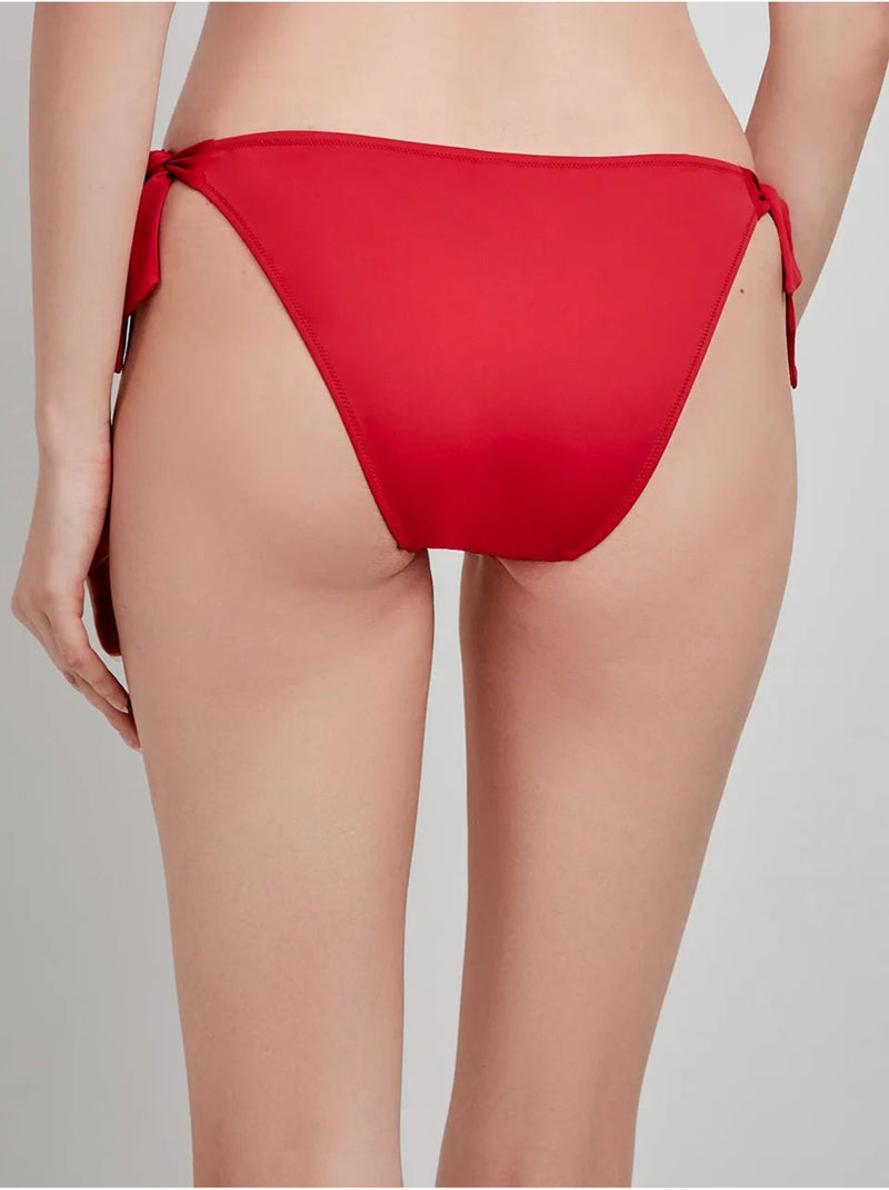 Slip bikini con fianchi regolabili Rosso - Kiabi