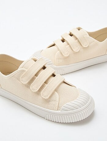 Sneakers basse in tela con strappi