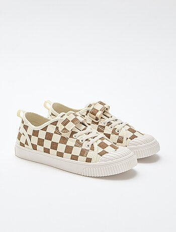 Sneakers in tela con strappo
