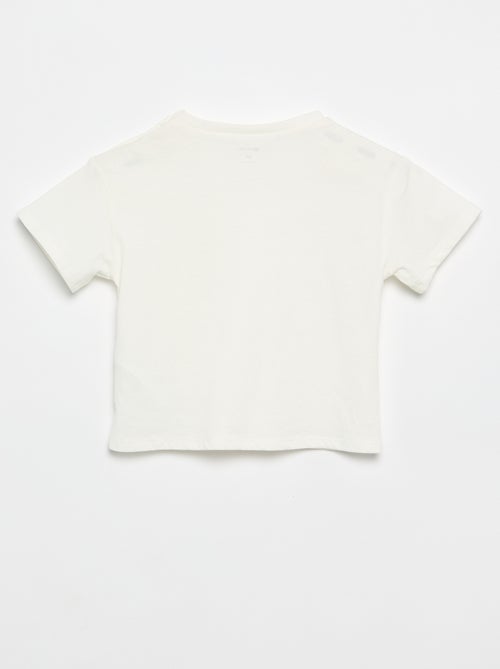 T-shirt a maniche corte con fiori sulla spalla - Kiabi T-shirt a maniche corte con fiori sulla spalla - Kiabi
