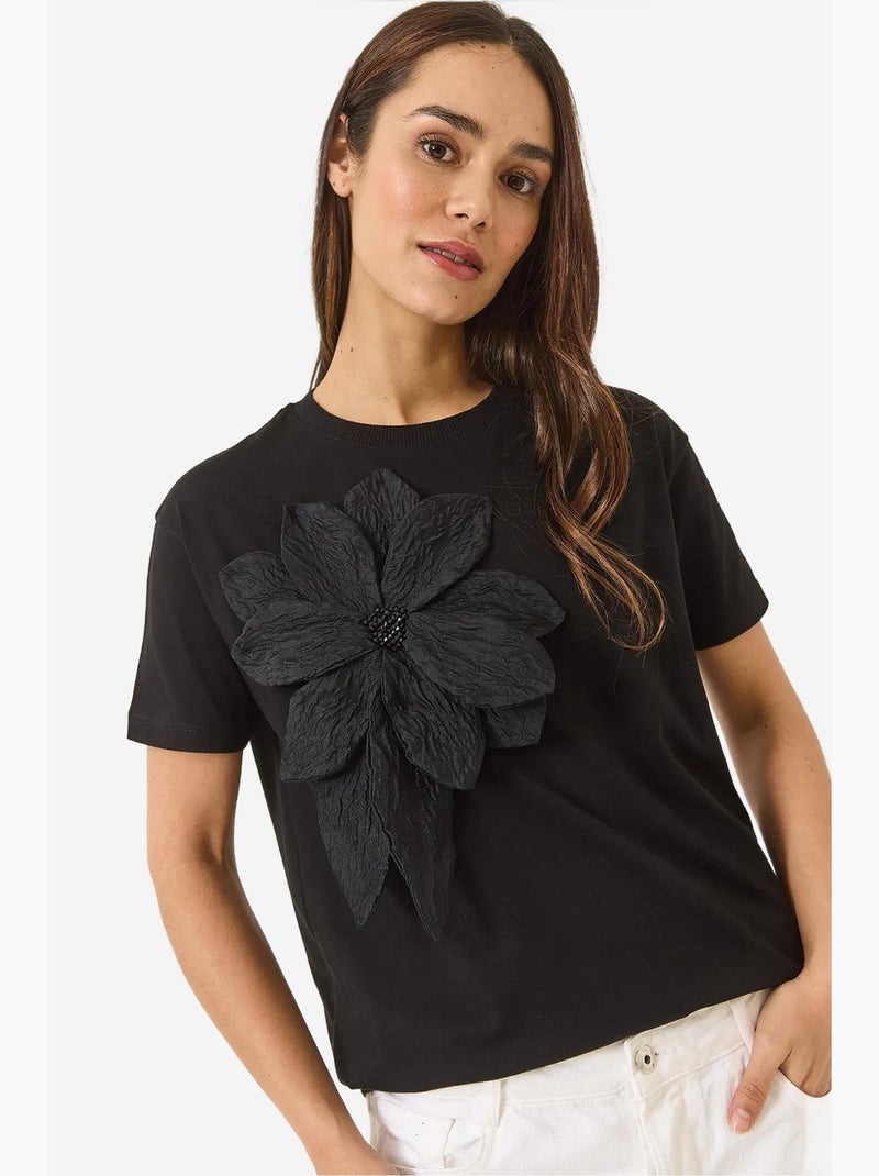T-shirt a maniche corte in cotone con accessorio floreale lucci Nero - Kiabi