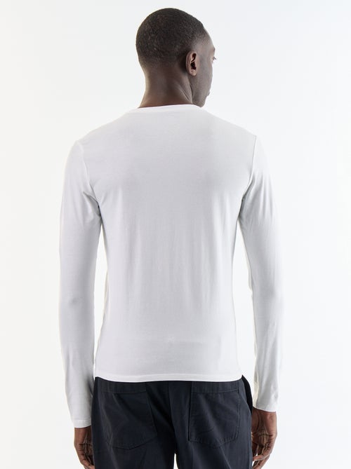 T-shirt a maniche lunghe tinta unita - Kiabi T-shirt a maniche lunghe tinta unita - Kiabi